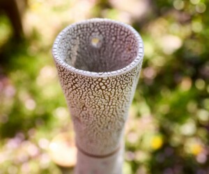 Ceramic coffee cup in a garden